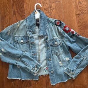 Denim Jacket girls size xs with floral design.